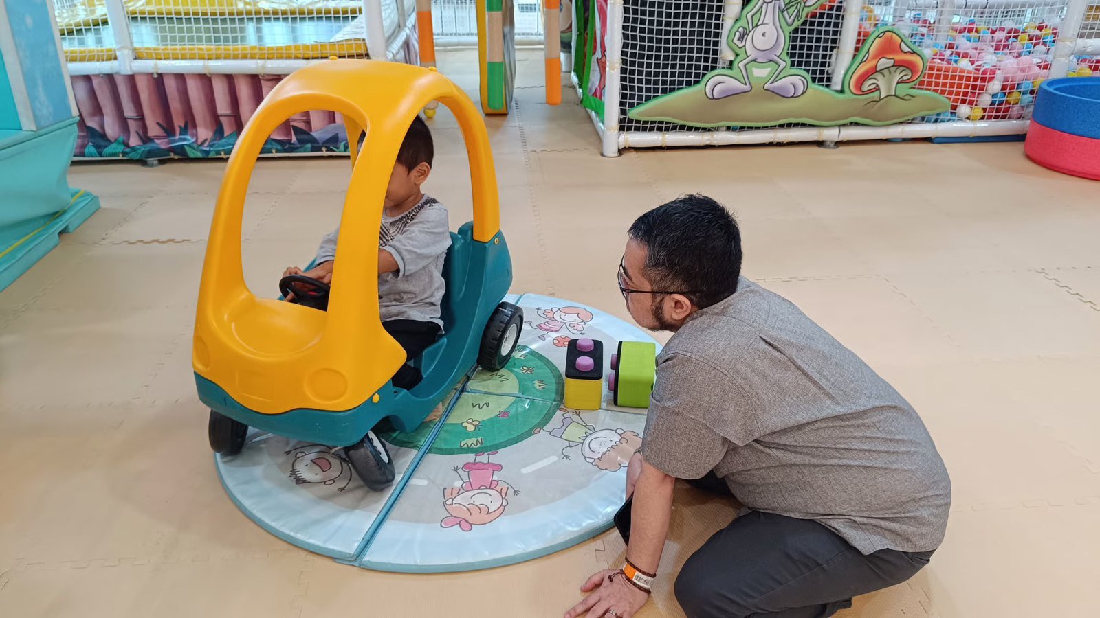 Faiz Hayaza supporting a child during play